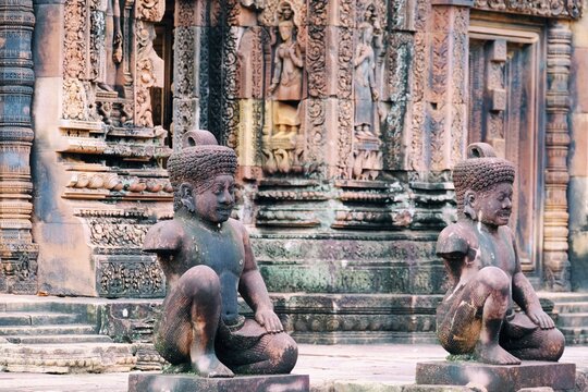Scenic shot of the Buddhist statues in front of the Banteay Srei temple in Siem Reap, Cambodia