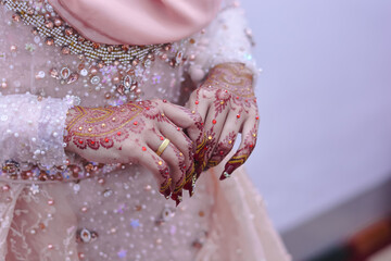 a woman who uses henna for her own wedding