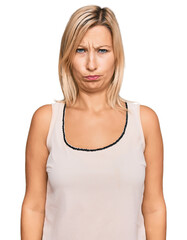 Middle age caucasian woman wearing casual clothes skeptic and nervous, frowning upset because of problem. negative person.