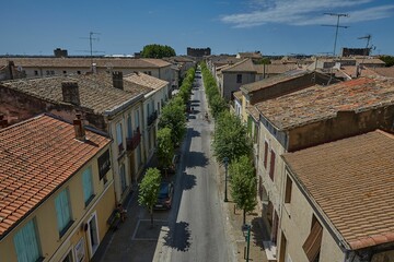 Narrow street surrounded by stony buildings in France