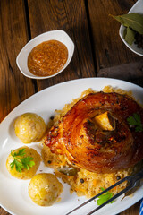 pork knuckle with sauerkraut and sweet mustard