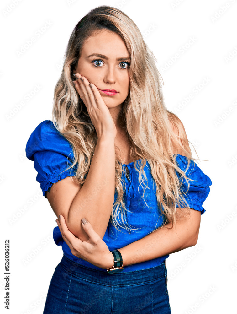 Sticker Young blonde woman wearing casual clothes thinking looking tired and bored with depression problems with crossed arms.