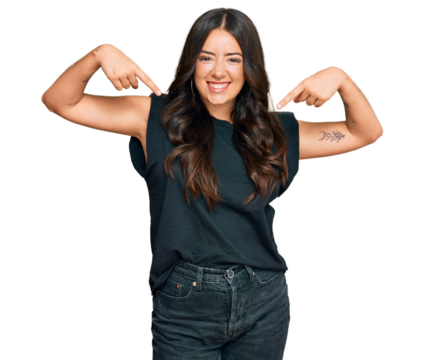 Beautiful brunette young woman wearing black shirt looking confident with smile on face, pointing oneself with fingers proud and happy.