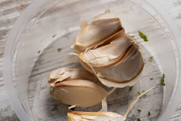 close-up shot of cloves of garlic on wooden background