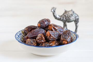 Date fruits for Moroccan tea drinking in traditional plate.