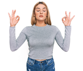 Young caucasian woman wearing casual clothes relax and smiling with eyes closed doing meditation gesture with fingers. yoga concept.