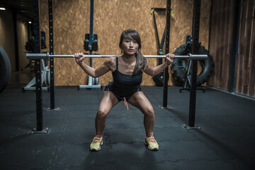 Fototapeta premium woman exercising with dumbbells