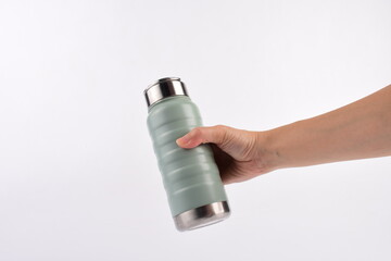 Hand holding cup cold storage. Tumbler glass cold store.