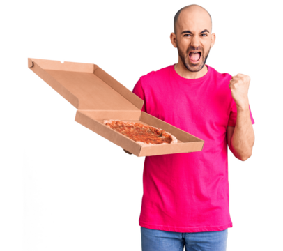 Young handsome man holding delivery pizza cardboard box screaming proud, celebrating victory and success very excited with raised arms