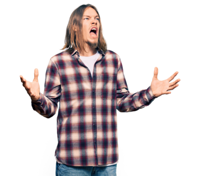 Handsome caucasian man with long hair wearing hipster shirt crazy and mad shouting and yelling with aggressive expression and arms raised. frustration concept.