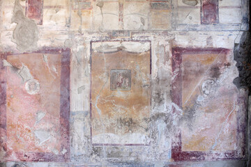 Fototapeta na wymiar Original ancient frescoes in Pompeii,Naples, Italy