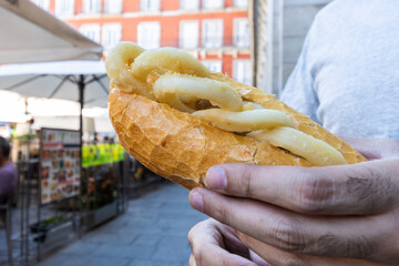 Typical squid sandwich from the Plaza Mayor in Madrid, Spain