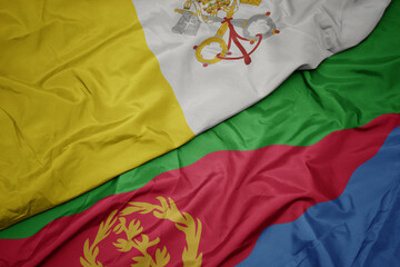 waving colorful flag of eritrea and national flag of vatican city.