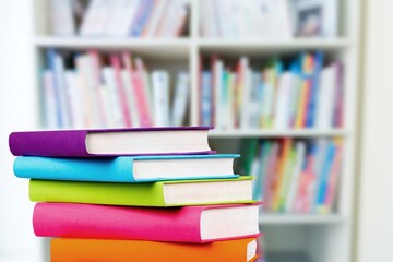 Big pile of books over light background. Education, self-learning, book swap, hobby, relax time