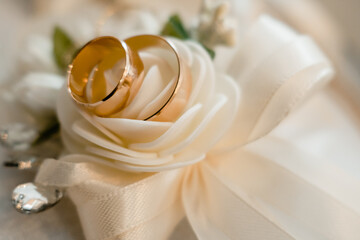 wedding rings on a bouquet of roses