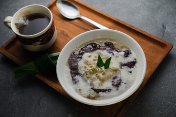 mung beans porridge 'bubur kacang hijau' serve with black glutinous sweet rice, coconut milk and...