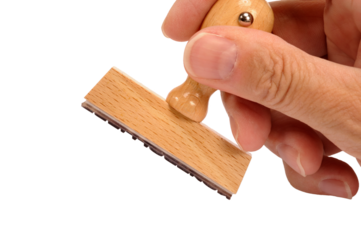 Holzstempel in Hand mit blankem Schriftfeld