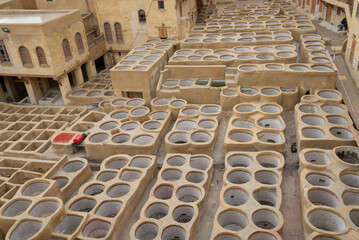 Traditional tannery old clean stone water baths without dye used to dye leather in the city of Fez,...