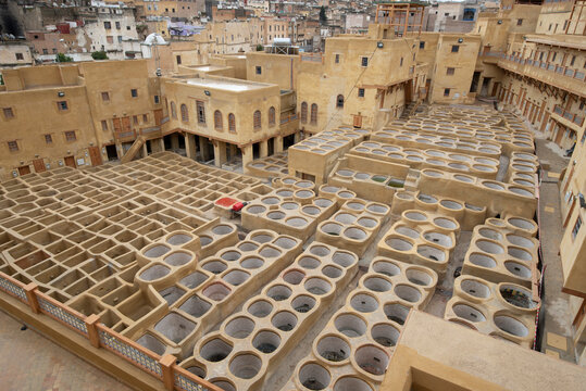 Traditional tannery old clean stone water baths without dye used to dye leather in the city of Fez, Morocco