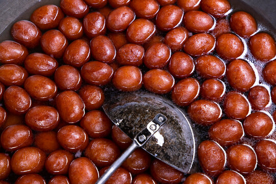 Red Sweet Rosogolla Bangladeshi Traditional Food background textured