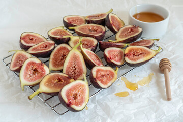 Honey covered fig fruits on drying rack. Ingredients for cooking.