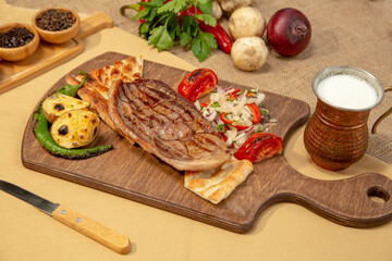 Delicious Turkish Traditional Kebab cutlet with grilled tomato on white plate stock photo
Above, Angle, Animal, Barbecue - Meal, Beef
