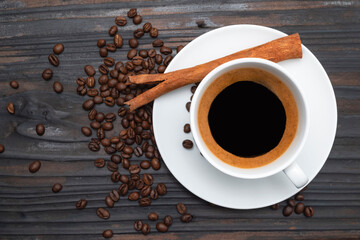 Espresso coffee morning homemade has bean dark on wood table.