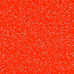 White speckled paper on orange surface