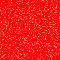 White speckled paper on a red surface