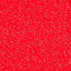 White speckled paper on red surface