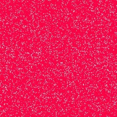 White speckled paper on red surface