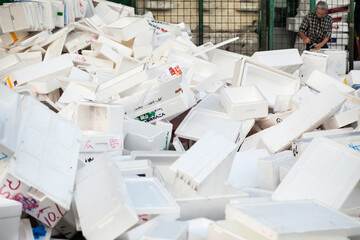 Large heap of empty used isothermal boxes in the former Tokyo's Tsukiji fish market 