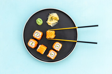 Sushi menu concept. Sushi roll set with salmon on dish