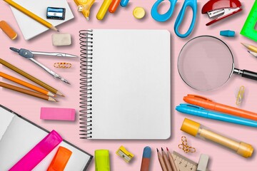 Back to school concept. Notepads pens erasers on  background