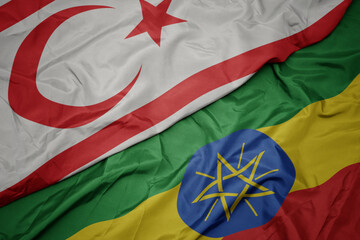 waving colorful flag of ethiopia and national flag of northern cyprus.