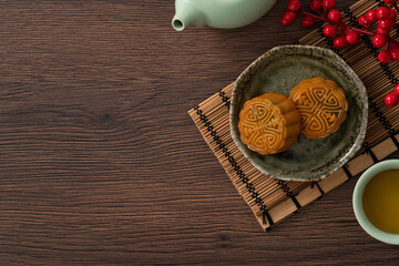 Delicious Cantonese moon cake for Mid-Autumn Festival food mooncake on wooden table background.
