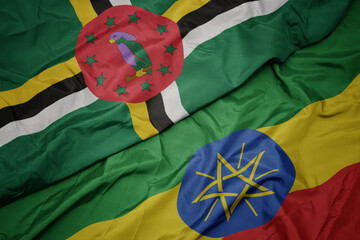 waving colorful flag of ethiopia and national flag of dominica.