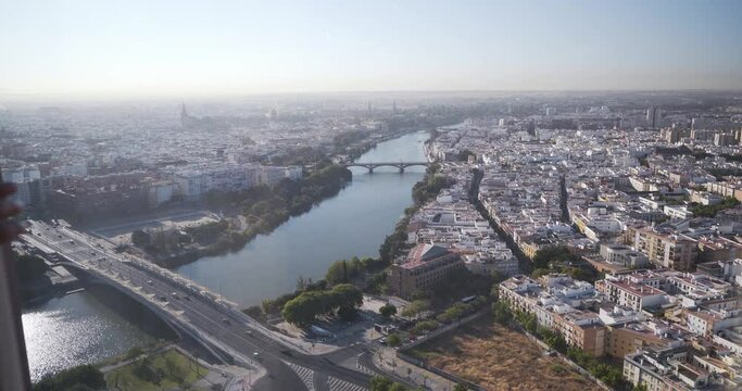 zoom view Revealing Curtains And Looking Outside Sevilla aerial view from skyscrapper tower