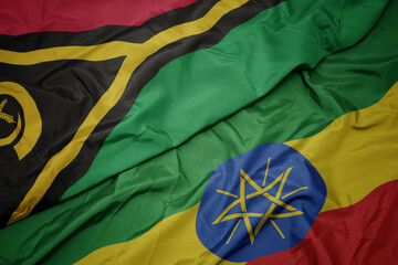 waving colorful flag of ethiopia and national flag of Vanuatu .
