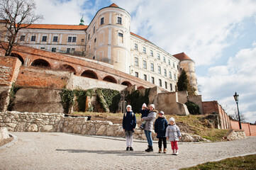 Family walking at historical Mikulov Castle, Moravia, Czech Republic. Old European town.