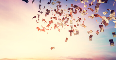 Money falling from sky - one hundred US dollar bills.