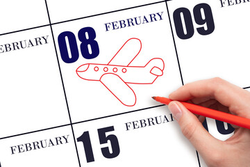 A hand drawing outline of airplane on calendar date 8 February. The date of flight on plane.