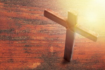 Wooden cross on the desk. Christian religion.