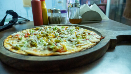 Vegetarian pizza in india. Indian Cheese Veg pizza.