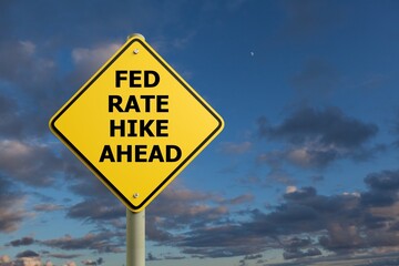 Naklejka premium Fed Rate Hike Ahead Caution Sign sky Background
