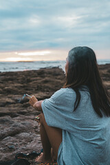 Person on the beach at dawn