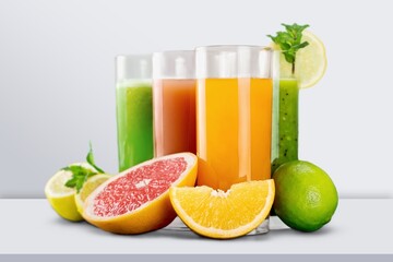 Lemon slush in tall glass with fruit and crushed ice on the desk.