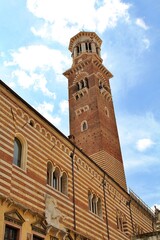 Fototapeta premium historic tower building, Italian historic architecture, Verona architecture, old tower, blue sky with white clouds