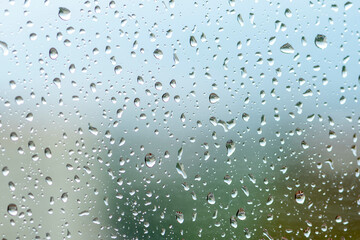 large raindrops on the window glass, rainy weather