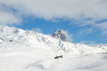 Fototapeta na wymiar Red Express in the Winter Season, Poschiavo Switzerland